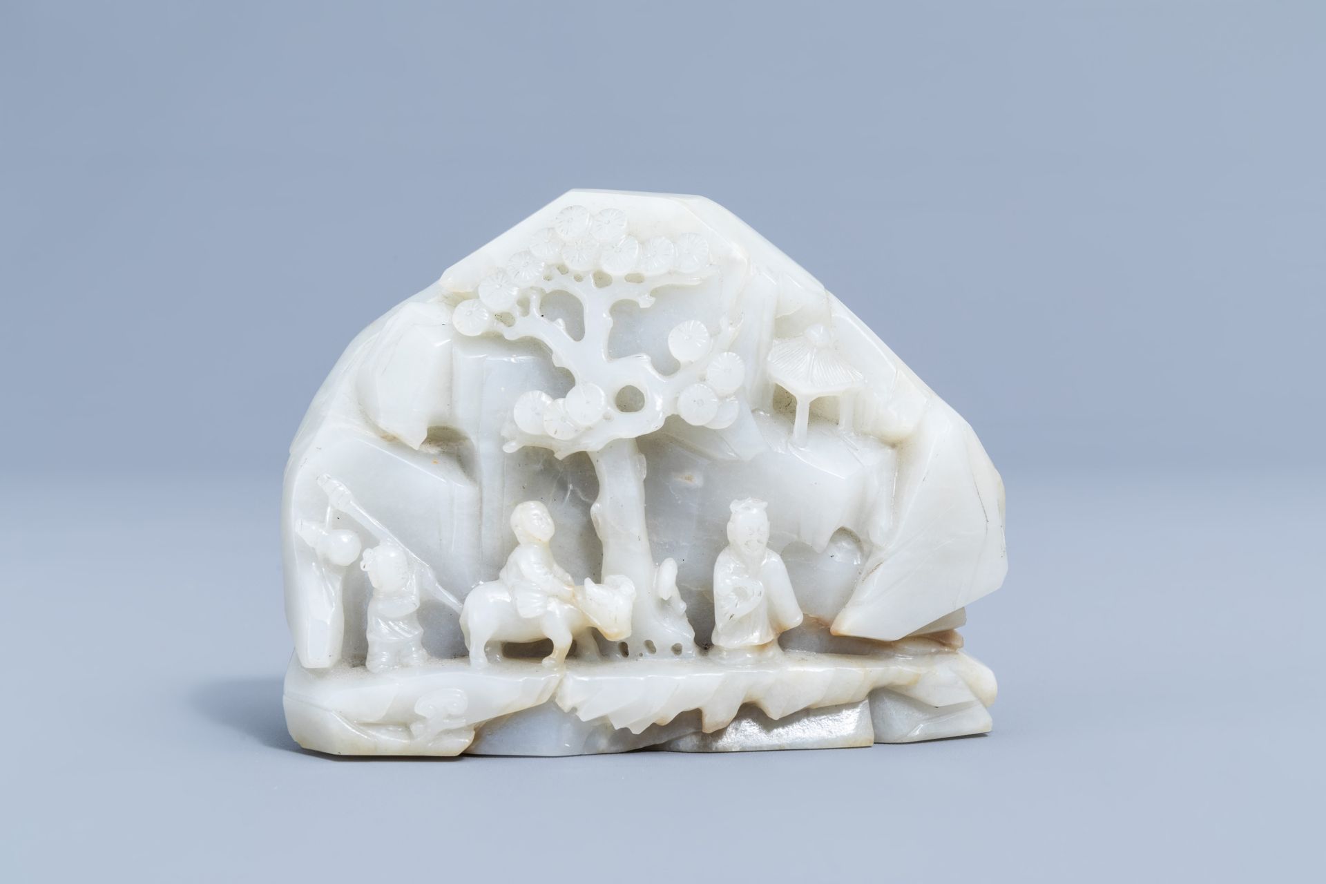 A Chinese double-sided celadon jade boulder with figures in a mountain landscape, 19th/20th C. - Image 2 of 4