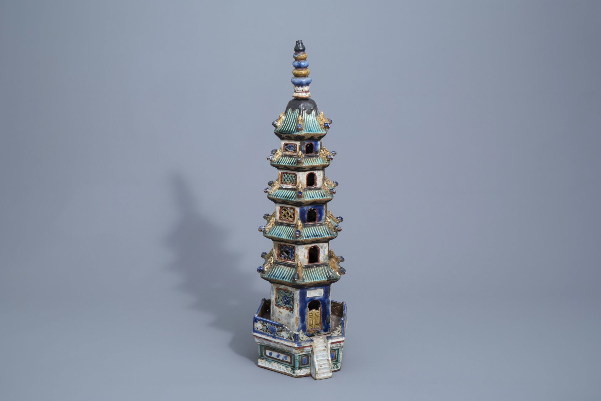 A Chinese three-piece glazed pottery pagoda, 19th C.