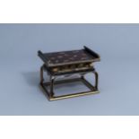 A Japanese gilt and lacquered wooden tray on stand with floral design, Meiji/Showa, 19th/20th C.