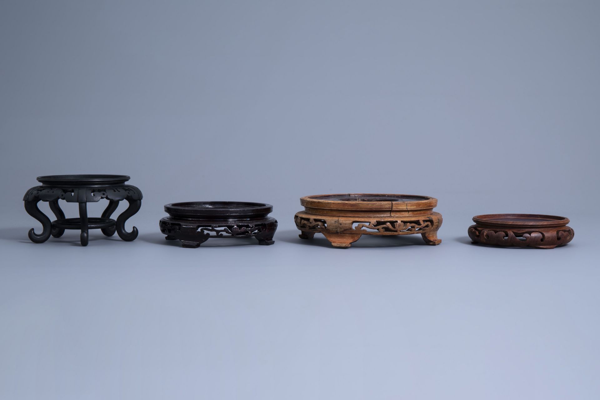A collection of Chinese carved wooden stands, 19th/20th C. - Image 11 of 32