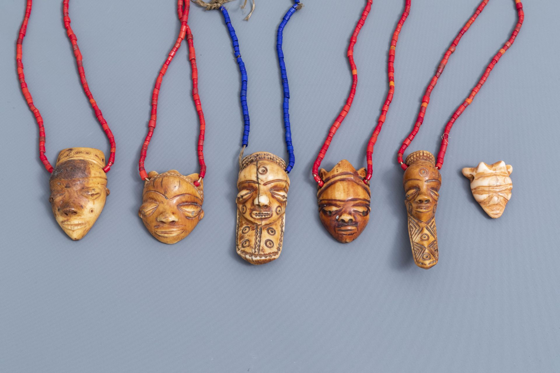 Six ivory Ikhoko pendants, Pende, Congo and a terracotta sculpture, Bura, Niger, 20th C. - Image 8 of 10
