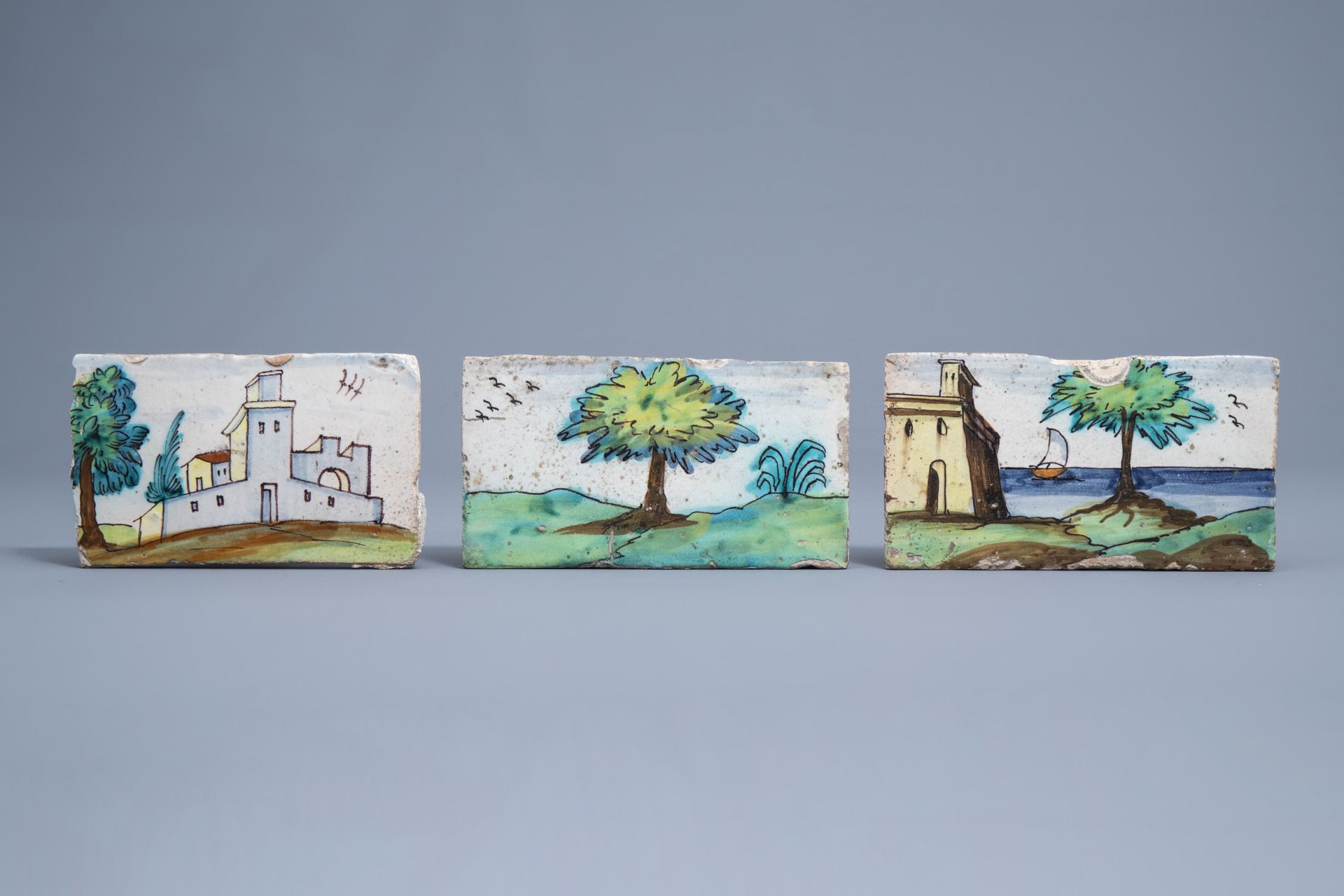 Three polychrome Spanish border tiles with landscapes, Talavera, 18th C.