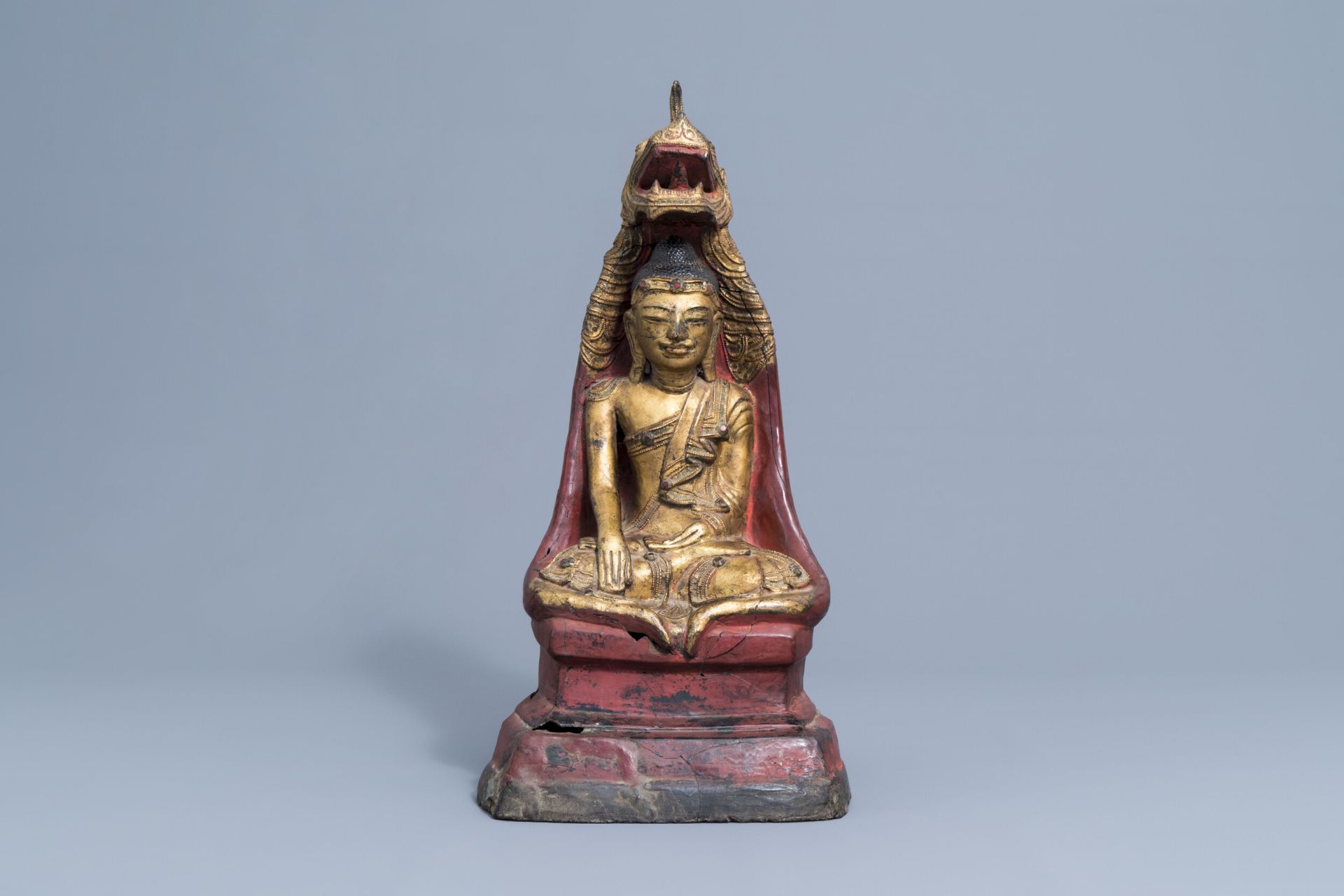 A large gilt, lacquered and polychrome Buddha with inlay, Burma or Laos, 19th/20th C.