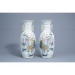 A pair of Chinese famille rose vases with Immortals and travellers with a donkey, 19th/20th C.