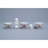 Three Japanese Kakiemon bowls and two boy shaped whistles, Edo, 18th/19th C.