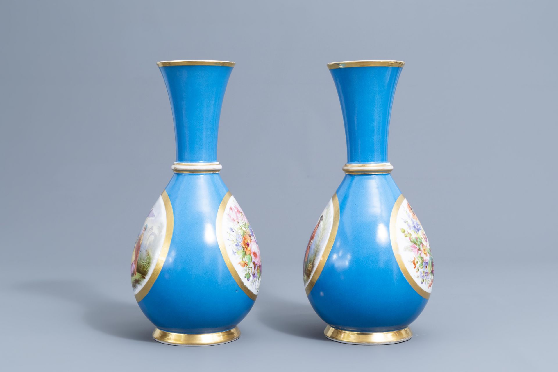 A pair of French 'bleu celeste' ground vases with gallant scenes and a German gilt charger, 20th C. - Image 9 of 24