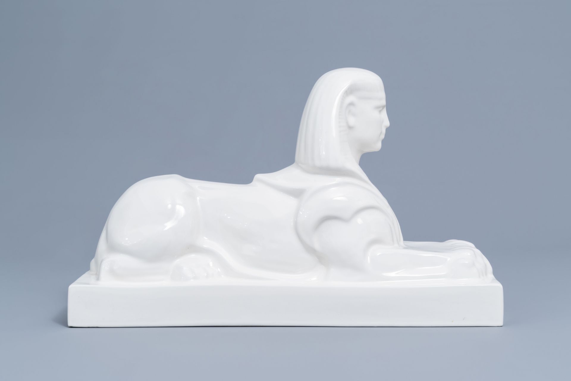 A large white glazed Maastricht earthenware figure of a sphinx, Petrus Regout, first half 20th C. - Image 3 of 8