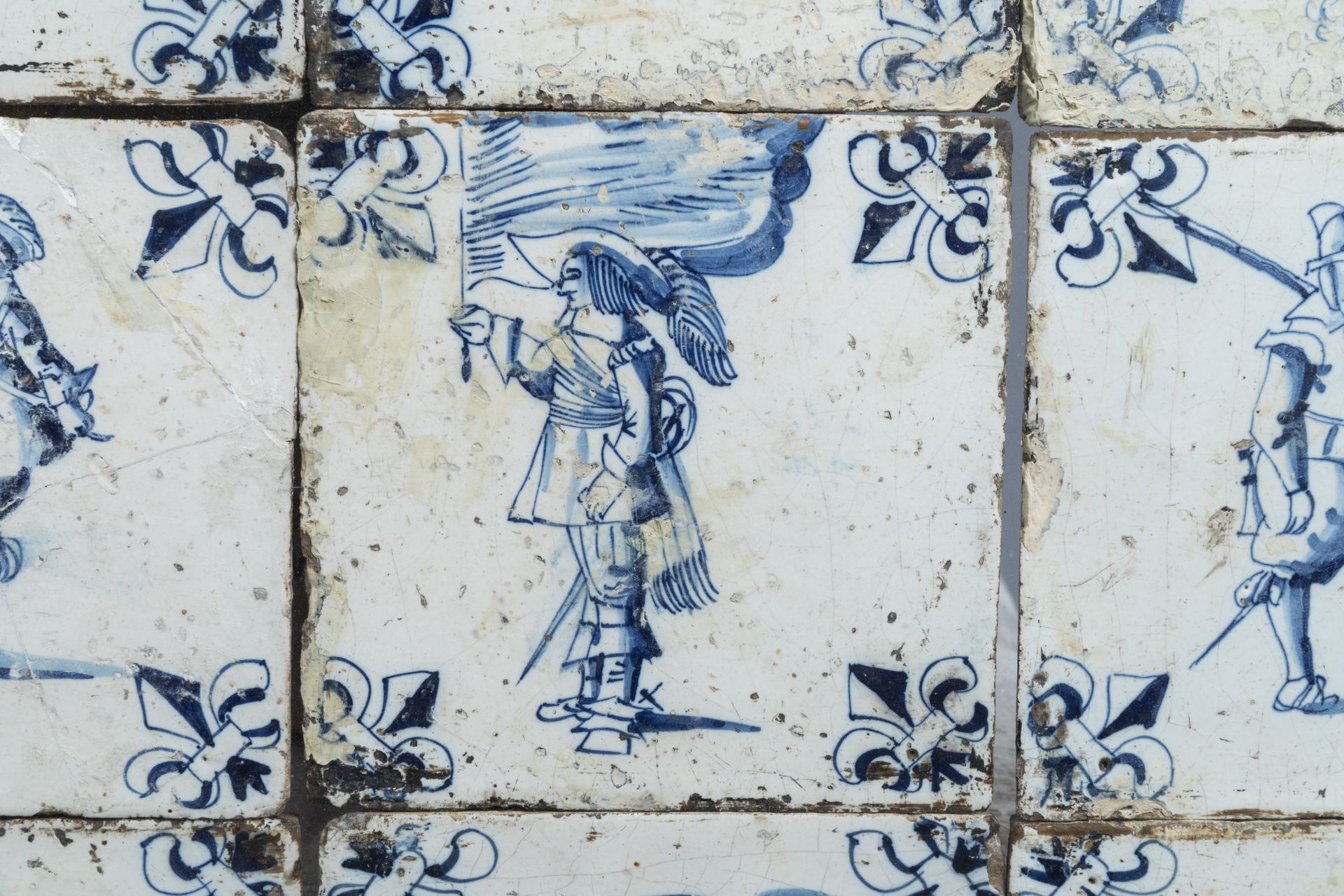 Sixteen Dutch Delft blue and white tiles with soldiers, 17th C. - Image 4 of 5