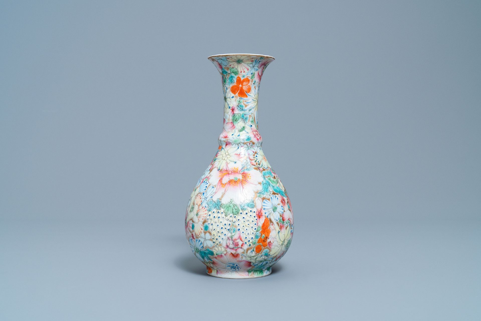A Chinese famille rose 'millefleurs' vase, Qianlong mark, Republic, 20th C. - Image 4 of 6