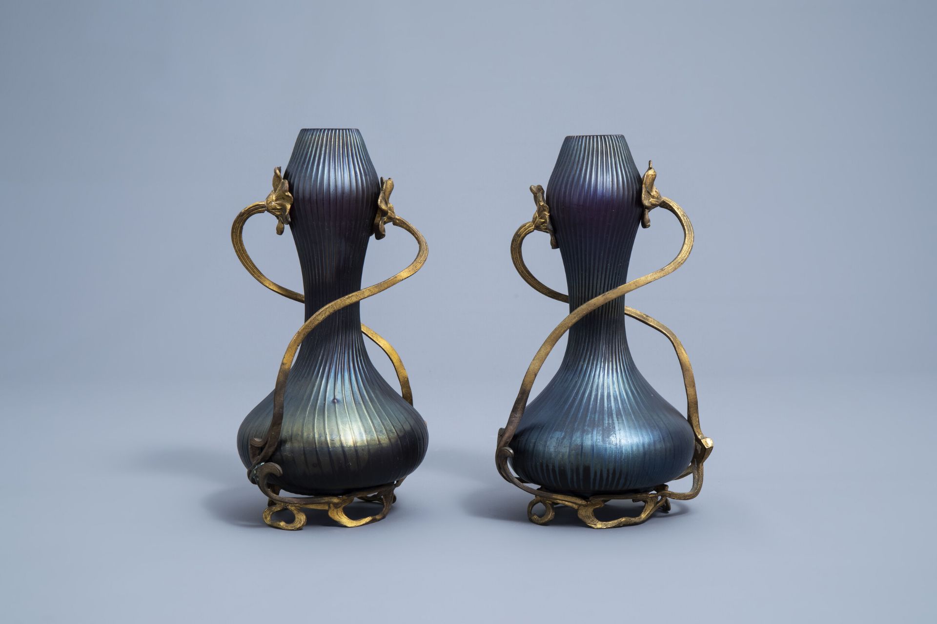 A pair of iridescent Art Nouveau style double gourd vases in the manner of Johann Loetz, 20th C.