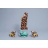 A pair of Chinese polychrome lions, a turquoise rabbit and a wooden Shou Lao group, 20th C.