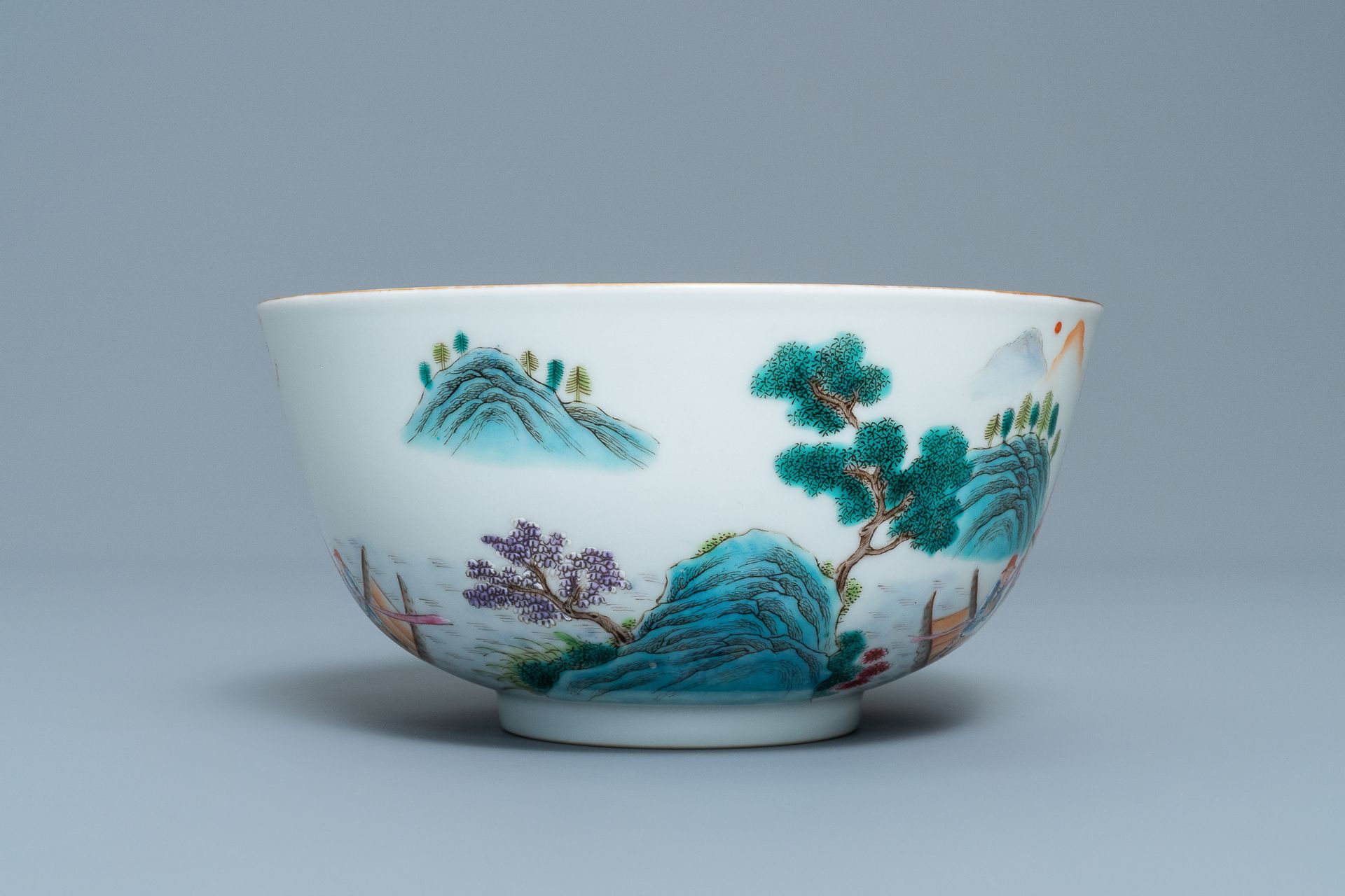 A fine Chinese famille rose bowl with figures in a river landscape, Qianlong mark, 20th C. - Image 5 of 7