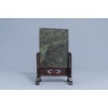 A Chinese jade 'dragons and phoenixes' plaque mounted in a wooden table screen, 20th C.