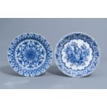 Two Dutch Delft blue and white chargers with a cornucopia and floral design, 18th C.