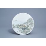 A round Chinese qianjiang cai plaque with a river landscape, 20th C.