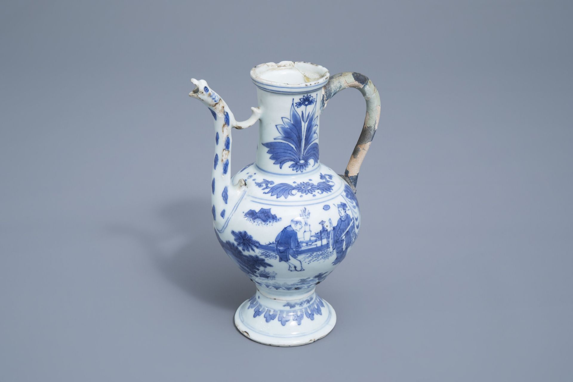 A Chinese blue and white ewer with figures in a landscape, Transitional period, 17th C.