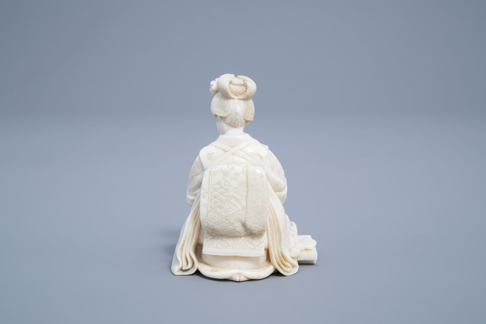 A signed Japanese ivory ikomono of a lady at work, Meiji, 19th/20th C. - Image 4 of 8