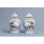 A pair of Chinese famille rose vases and covers with ladies, Qianlong mark, 20th C.