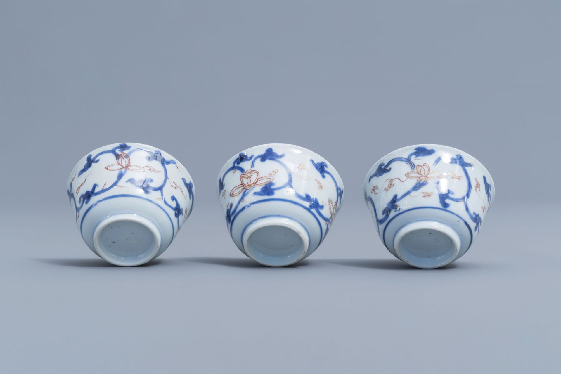 Six Chinese blue, white, iron red and gilt cups and saucers with floral design, Kangxi - Image 19 of 34