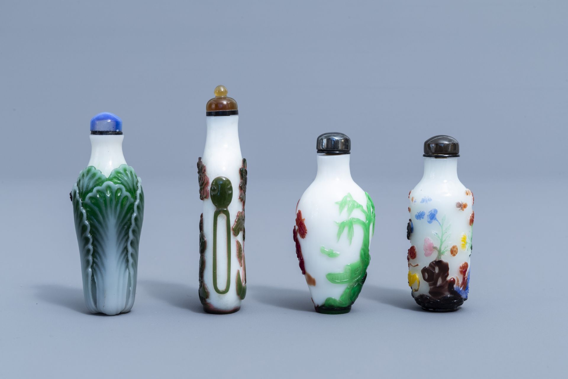 Eight Chinese overlay glass snuff bottles, 20th C. - Image 4 of 4