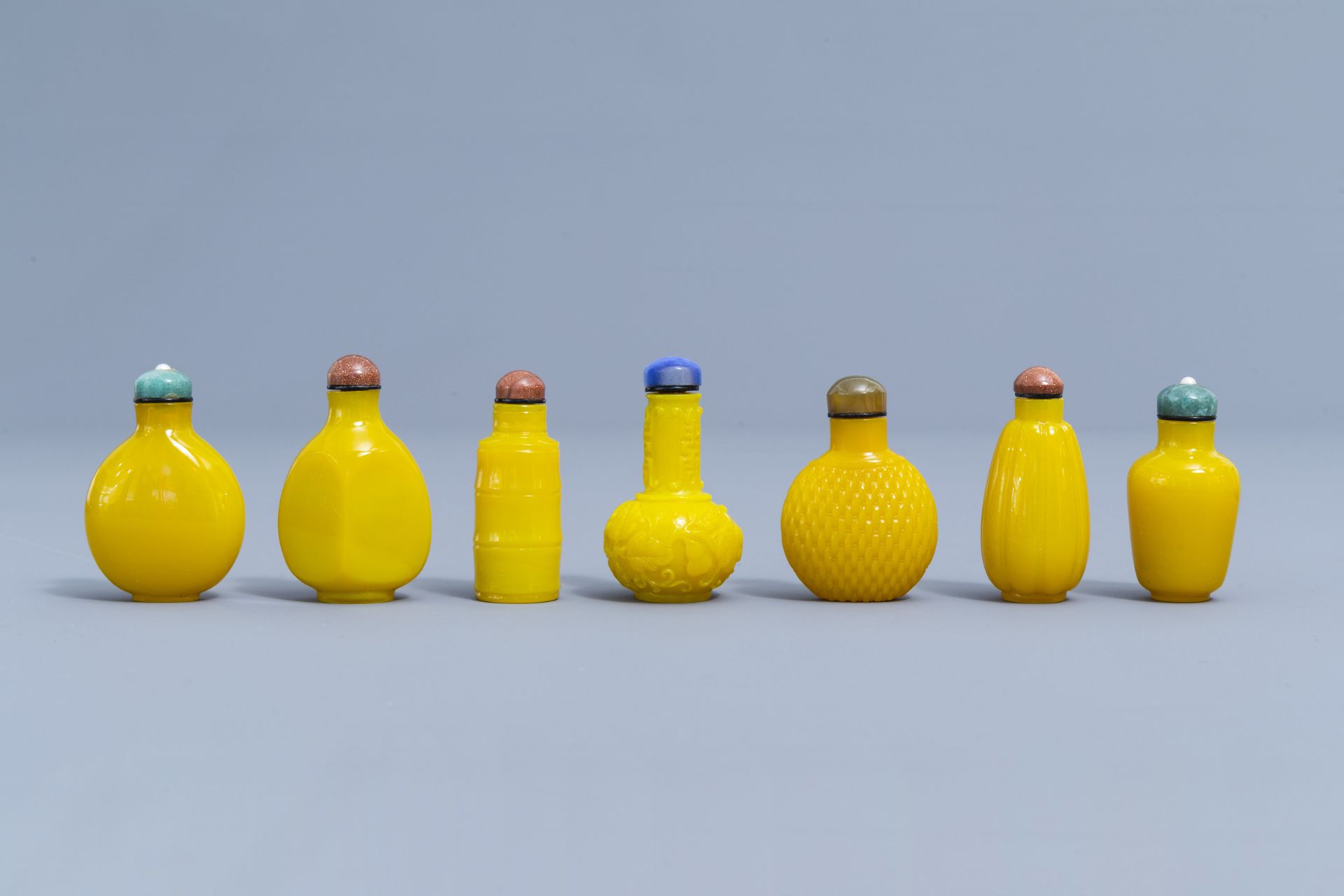 Thirteen Chinese yellow monochrome and overlay glass snuff bottles, 20th C. - Image 2 of 4
