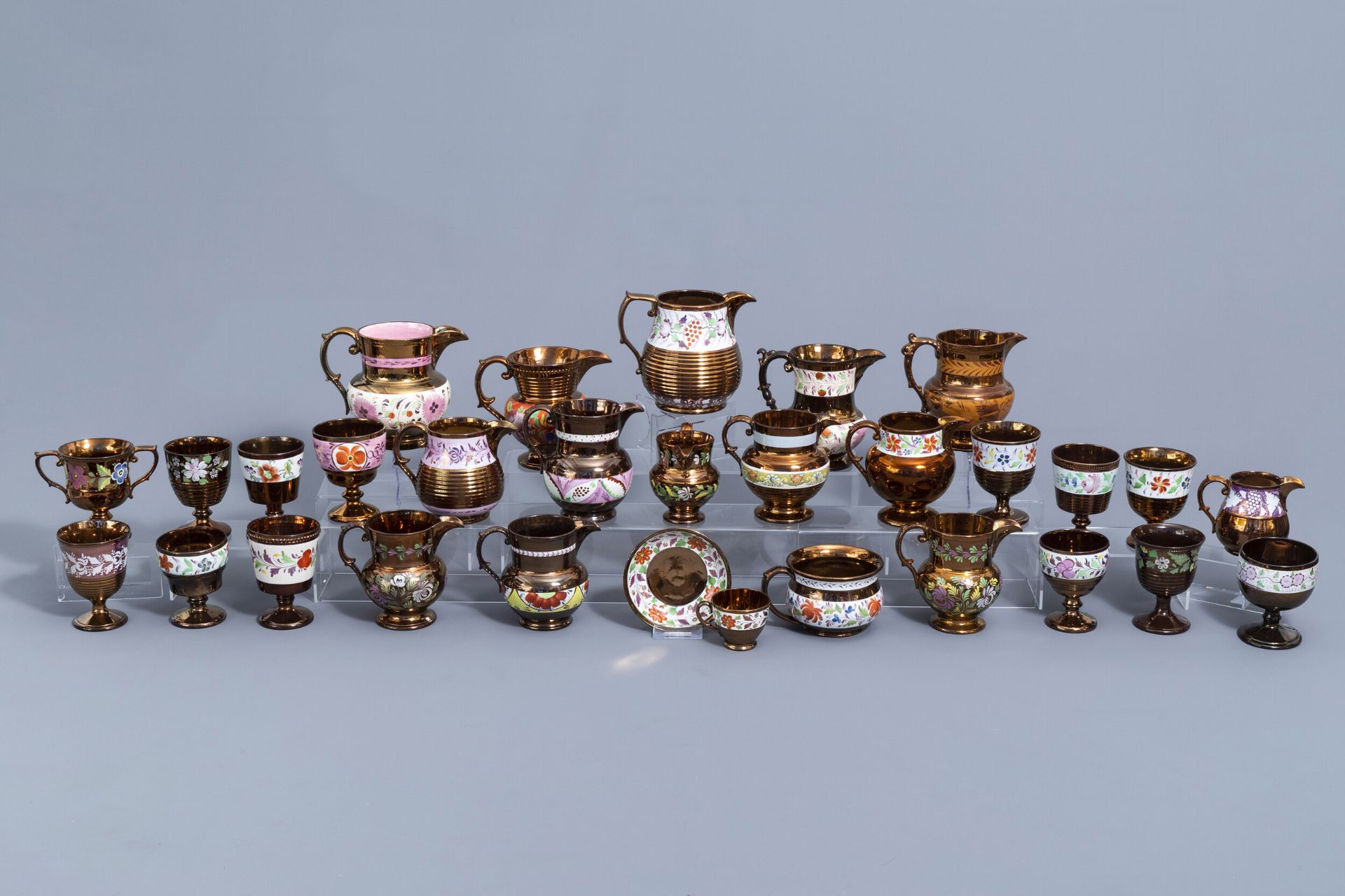 A varied collection of English lustreware items with polychrome floral design, 19th C.