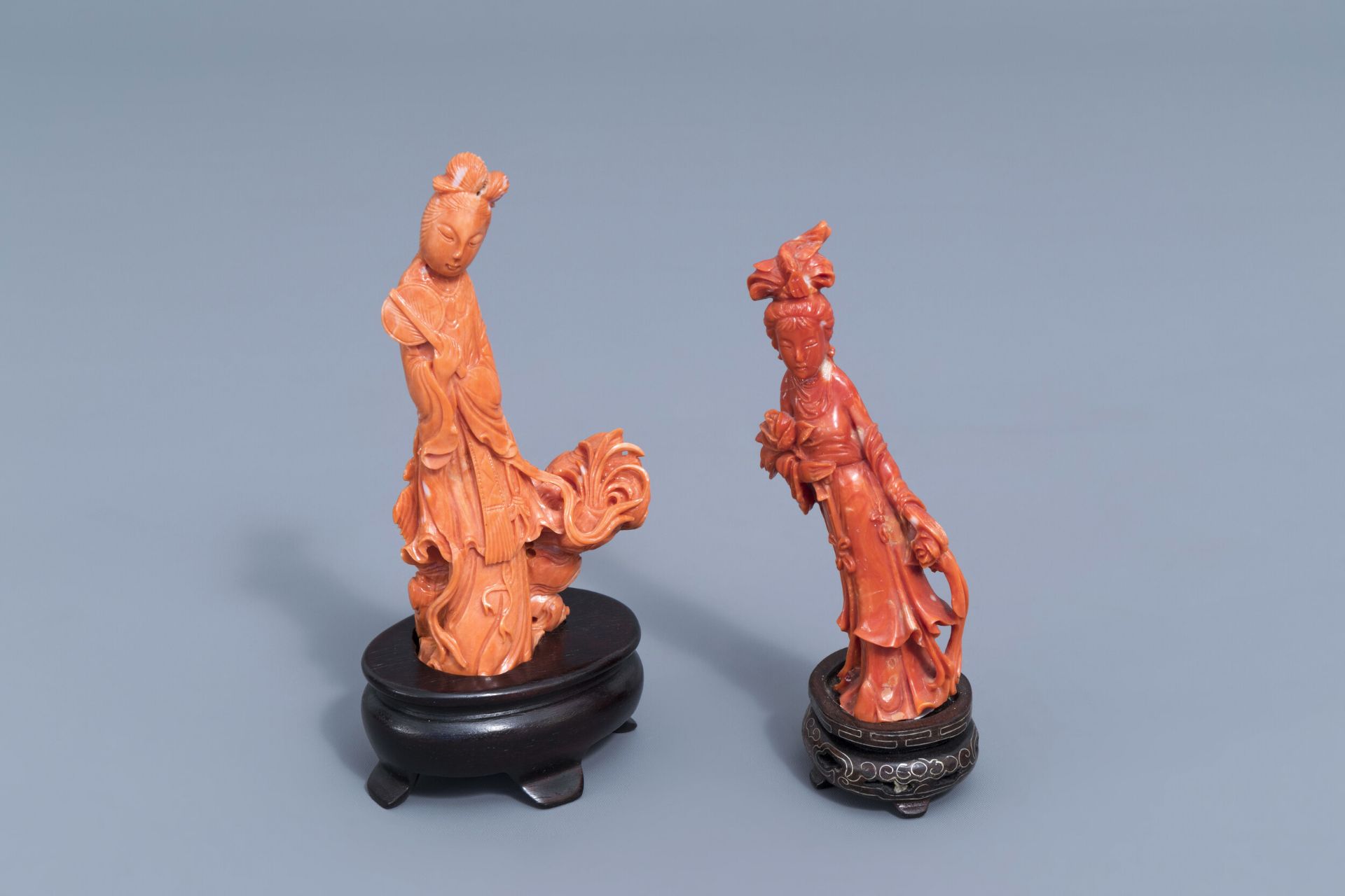 Two Chinese carved red coral figures of a lady, 19th/20th C.