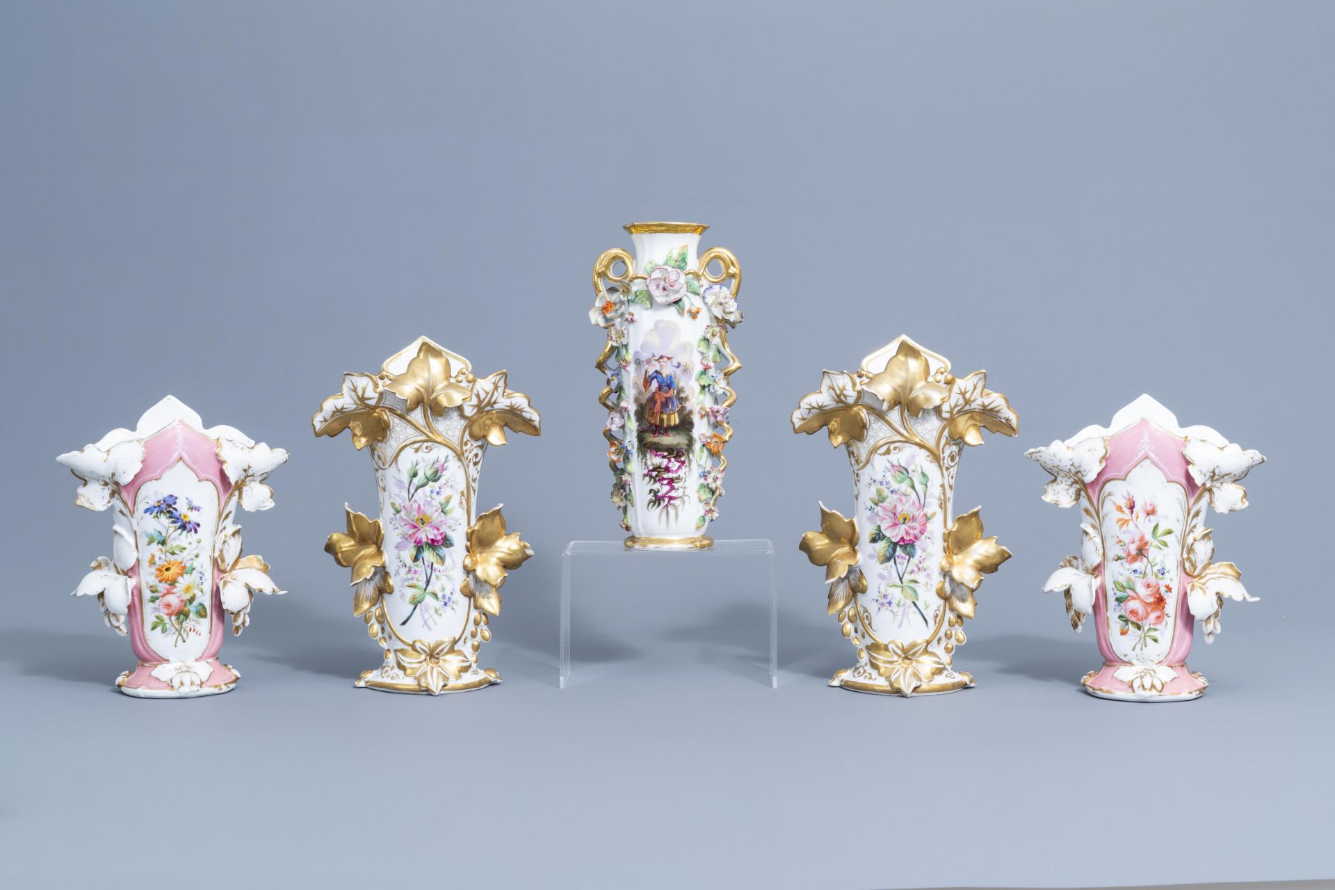 Two pairs of gilt and polychrome Paris porcelain vases and a 'chinoiserie' vase, 19th C.