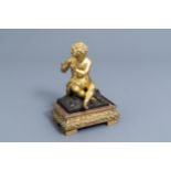 French school: A flute player with a goat, gilt and patinated bronze on a gilt mounted wooden base,