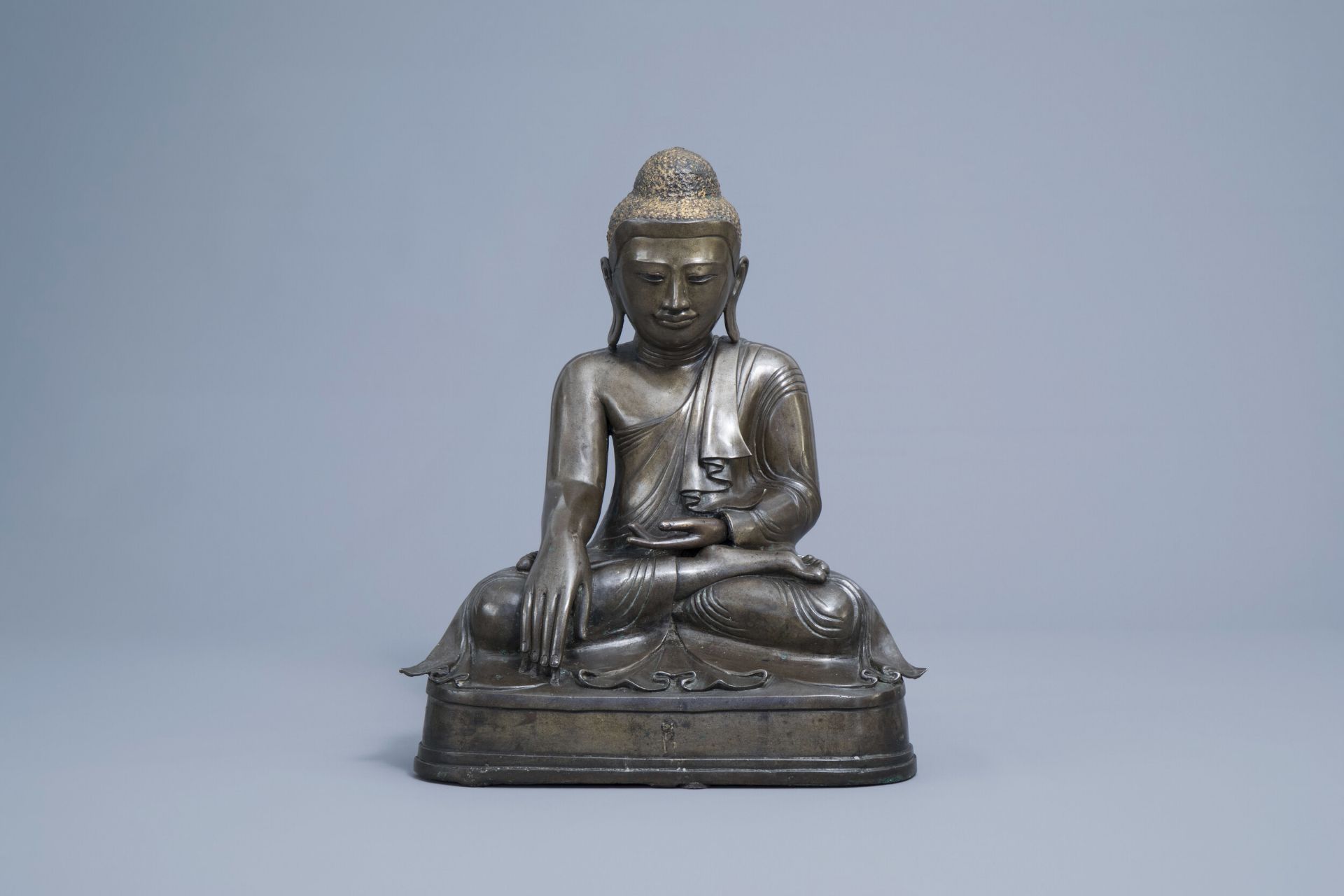 A large patinated and gilt bronze Buddha figure, Burma, Mandalay period, 19th C.