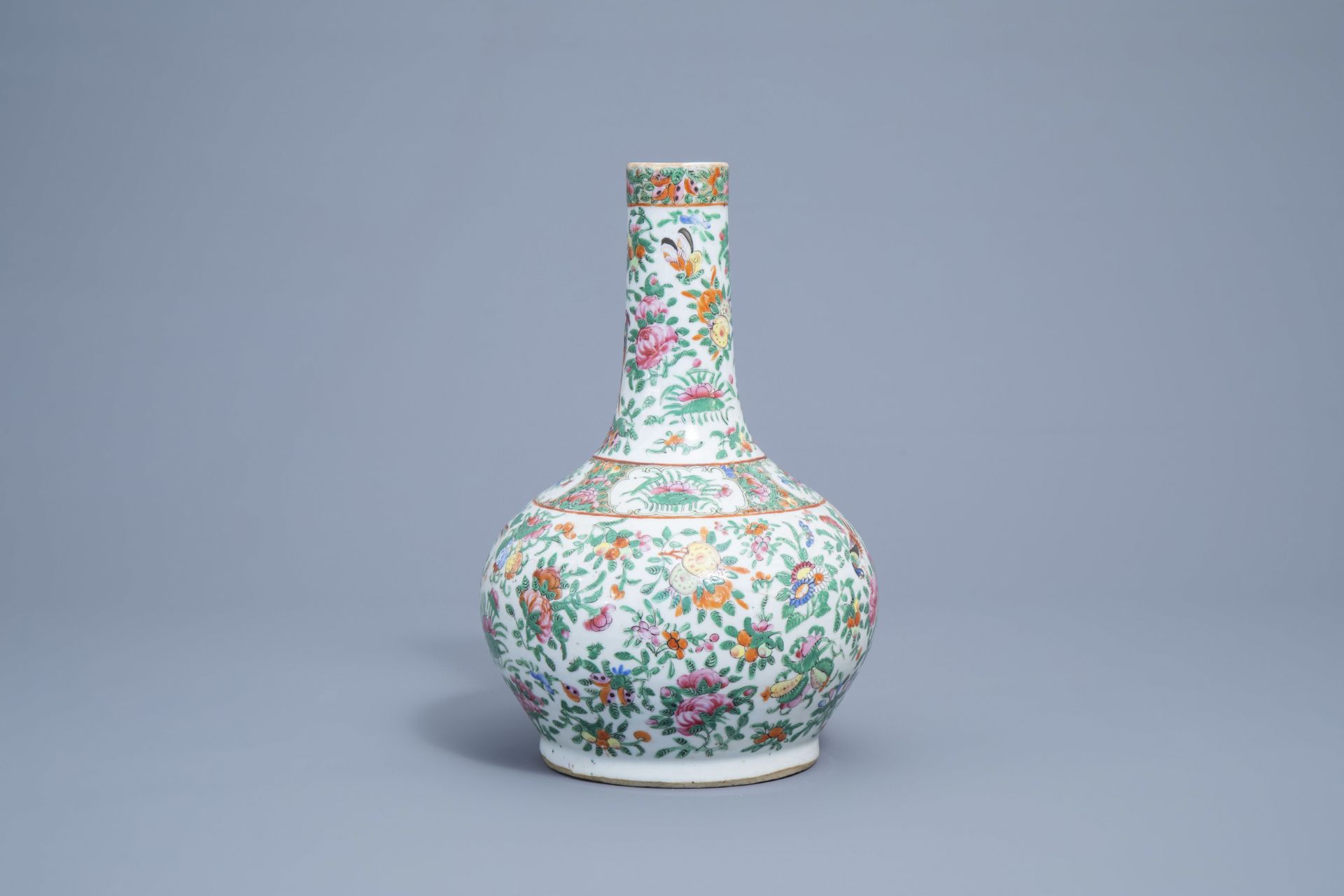A Chinese Canton famille rose bottle vase with floral design, 19th C. - Image 5 of 7