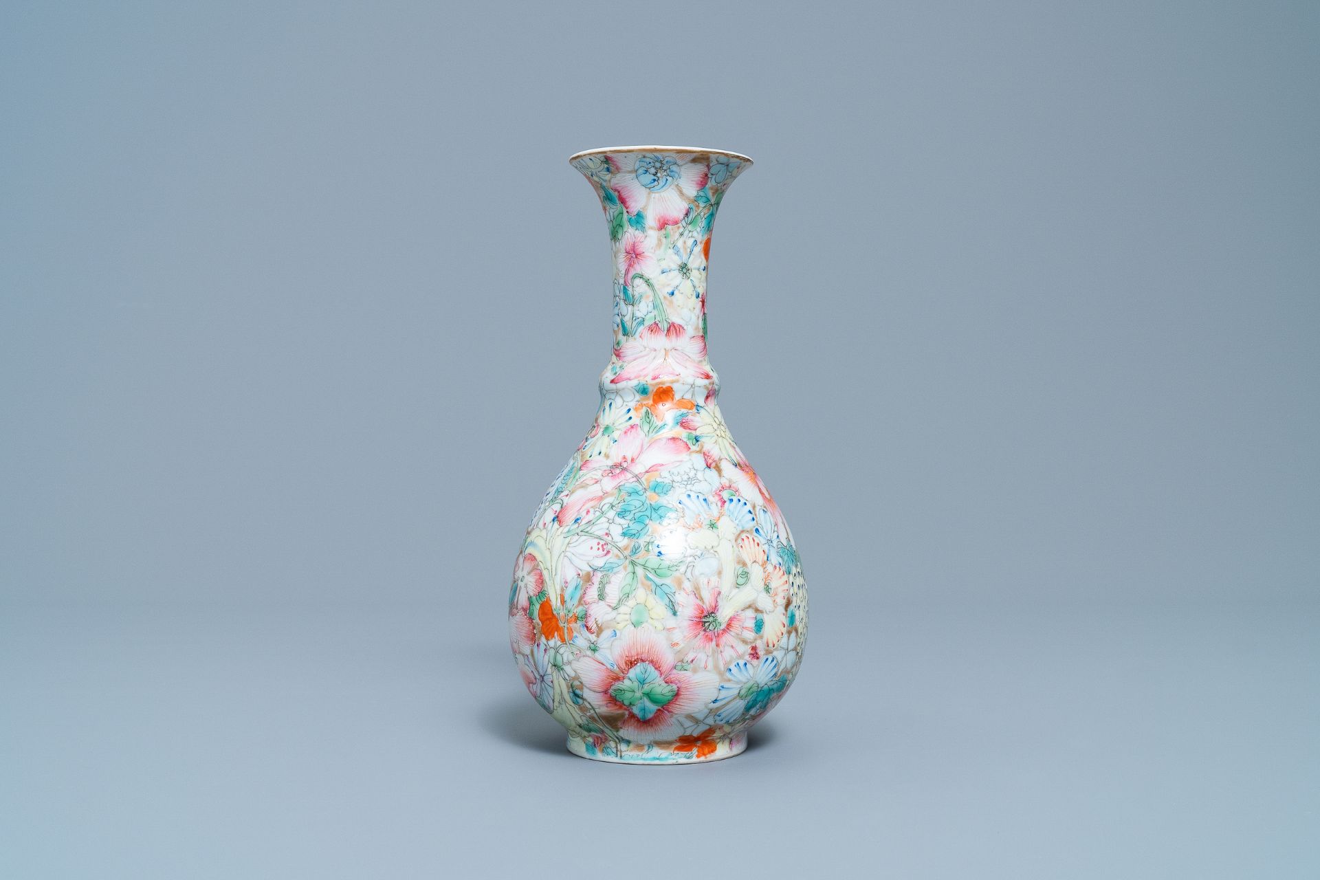 A Chinese famille rose 'millefleurs' vase, Qianlong mark, Republic, 20th C. - Image 3 of 6