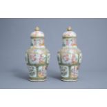 A pair of Chinese Canton famille rose vases and covers, 19th C.