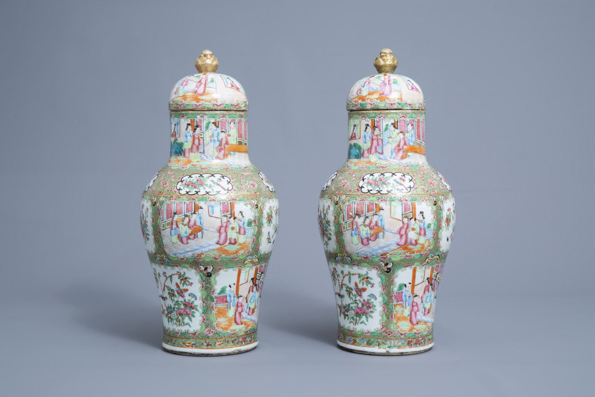 A pair of Chinese Canton famille rose vases and covers, 19th C.