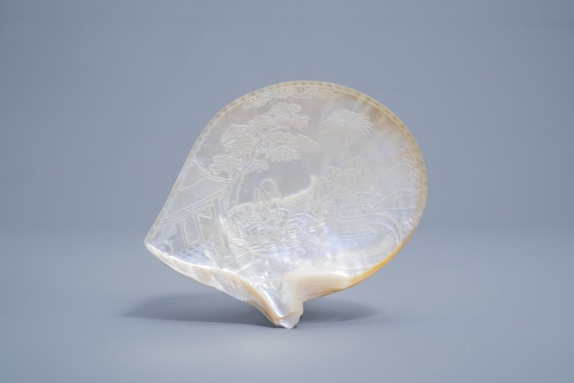 A pair of Chinese carved mother-of-pearl shells on wooden stands, 19th C. - Image 8 of 11