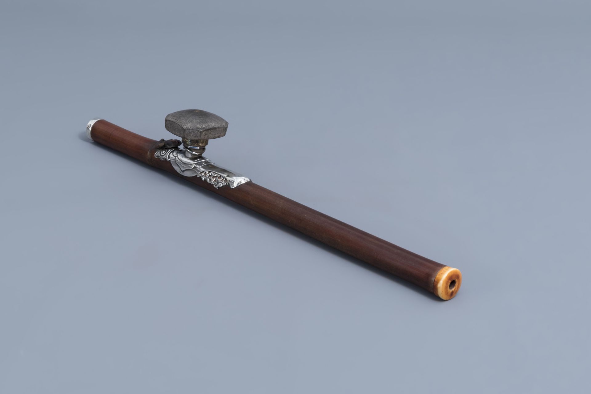 A Chinese bamboo opium pipe with silver saddle, ivory mouthpiece and stoneware damper, 19th C. - Image 2 of 10