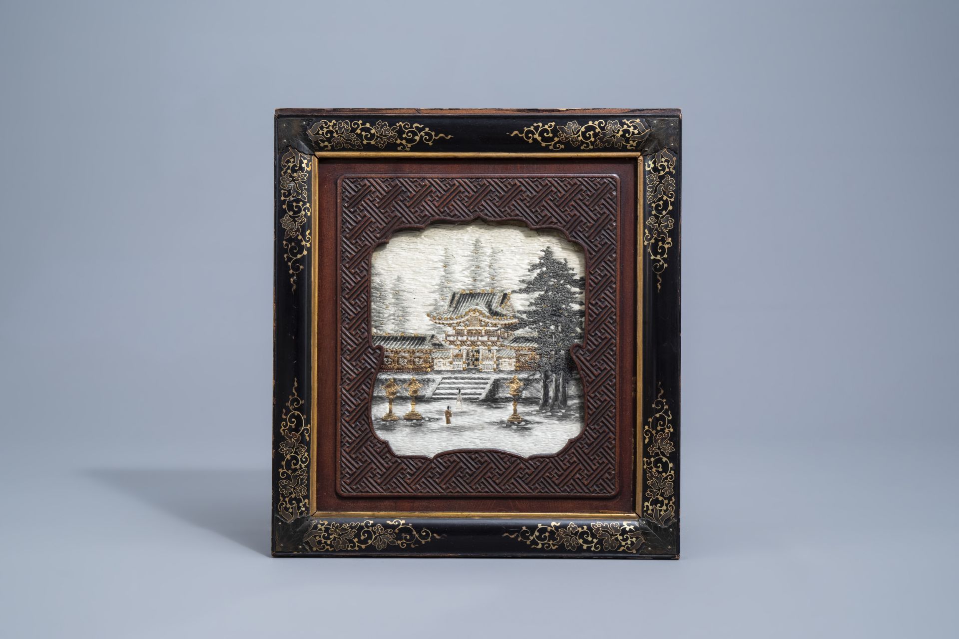 A Japanese silk embroidery with a temple in a lacquered and carved wooden frame, Meiji, 19th C. - Image 2 of 3