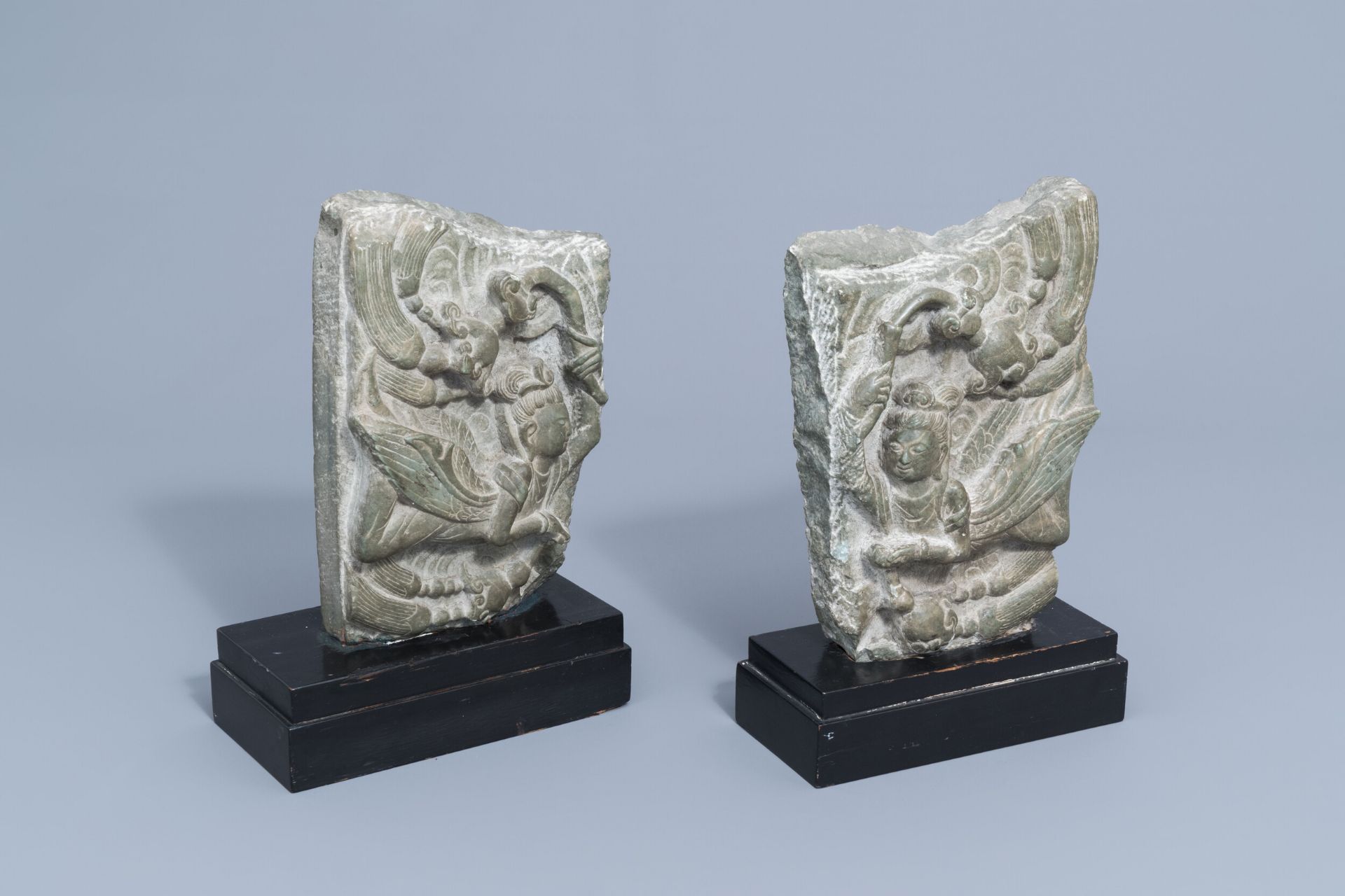 Two Chinese carved stone fragments with winged ladies, 20th C.