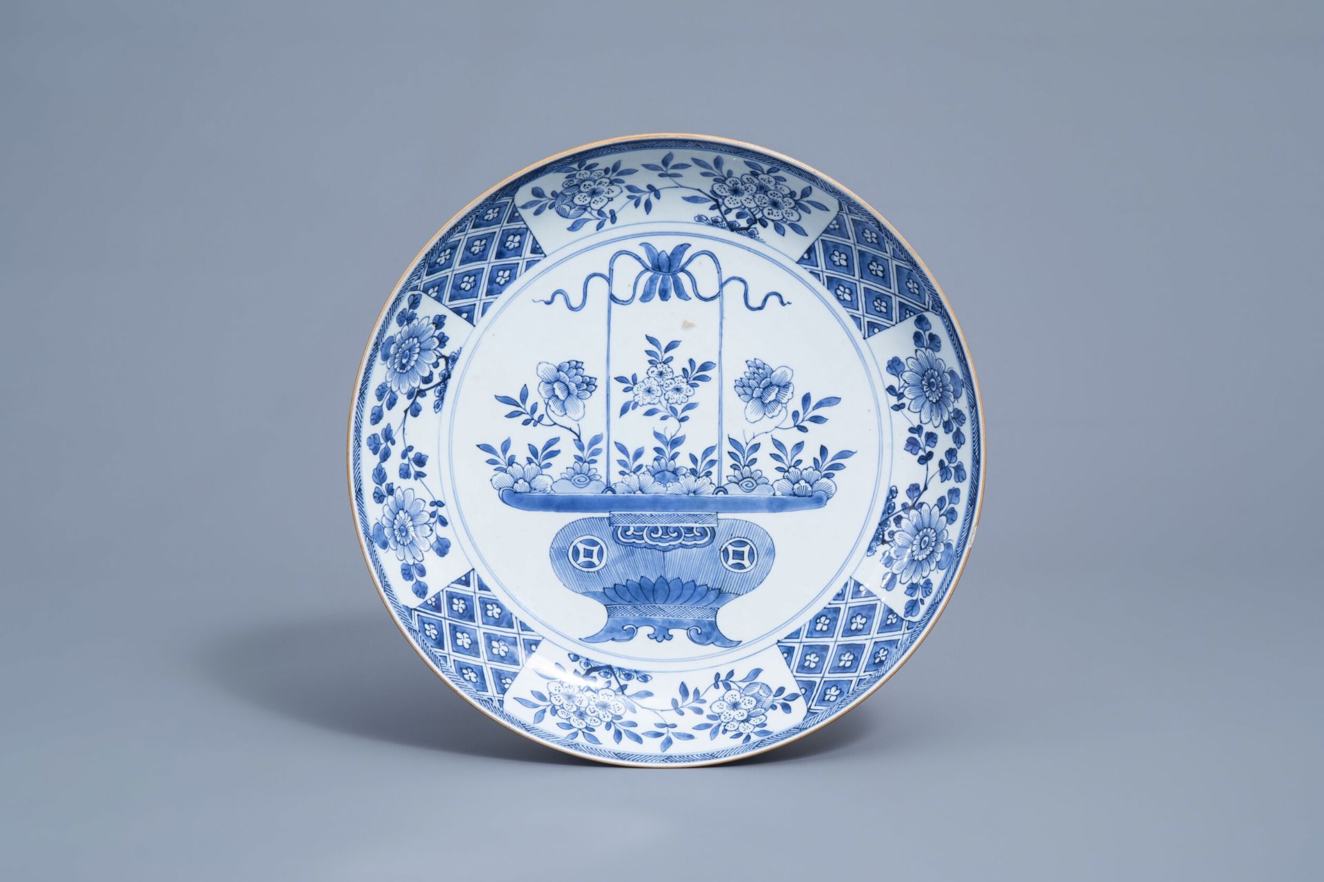 A Chinese blue and white 'flower basket' charger, Kangxi