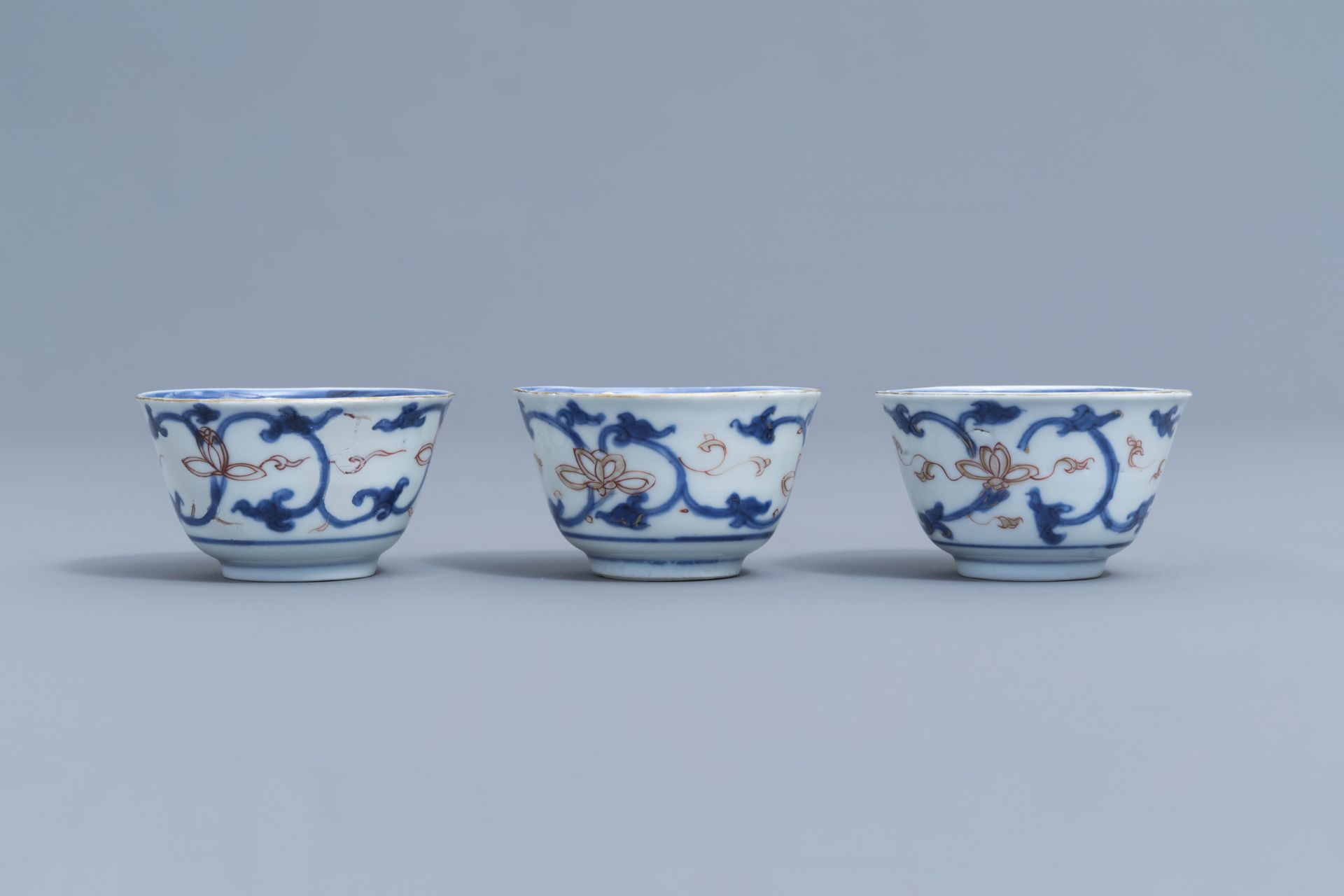 Six Chinese blue, white, iron red and gilt cups and saucers with floral design, Kangxi - Image 13 of 34