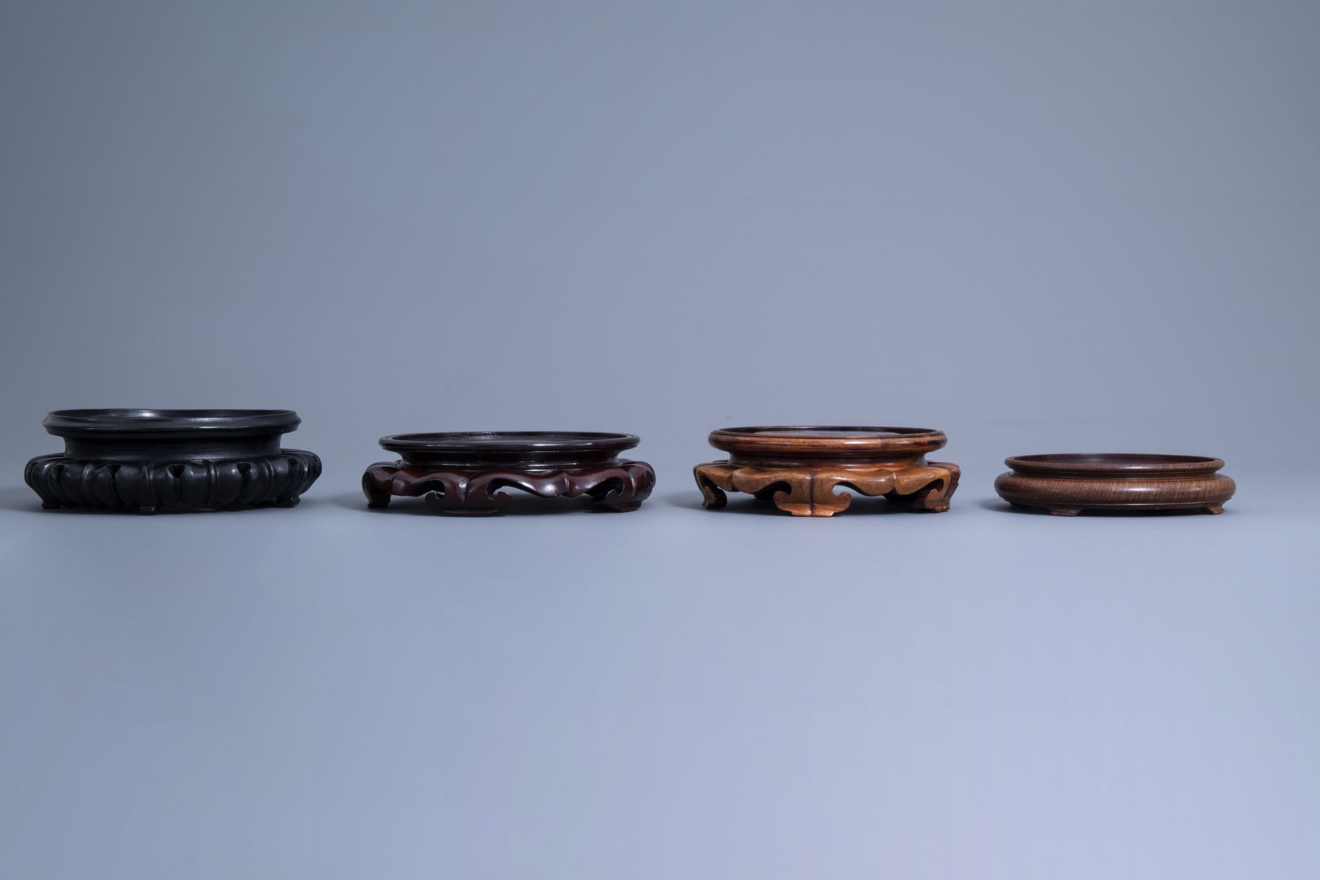 A collection of Chinese carved wooden stands, 19th/20th C. - Image 5 of 32