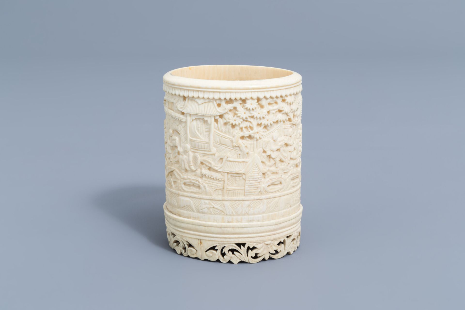 A Chinese richly carved ivory brush pot, Canton, 19th C.