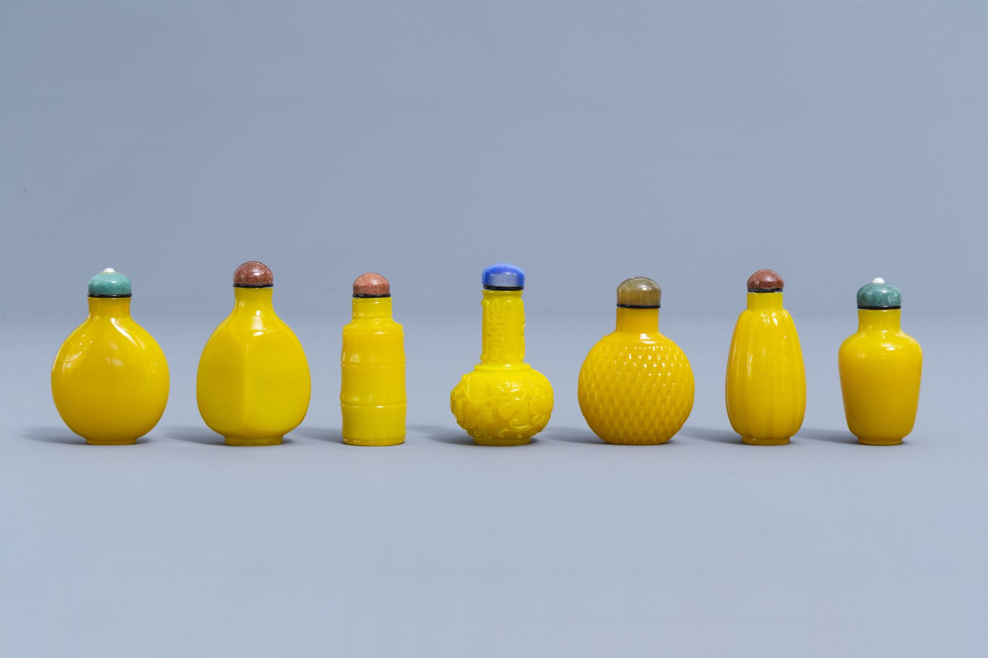 Thirteen Chinese yellow monochrome and overlay glass snuff bottles, 20th C. - Image 4 of 4