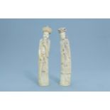 A pair of Chinese inlaid carved ivory figures of the emperor couple, first half of the 20th C.