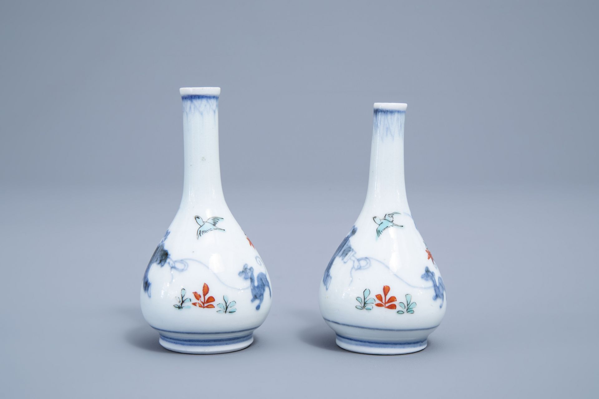 A pair of Japanese Kakiemon doll's house miniature vases with a playing child, Edo, 17th/18th C. - Image 4 of 6