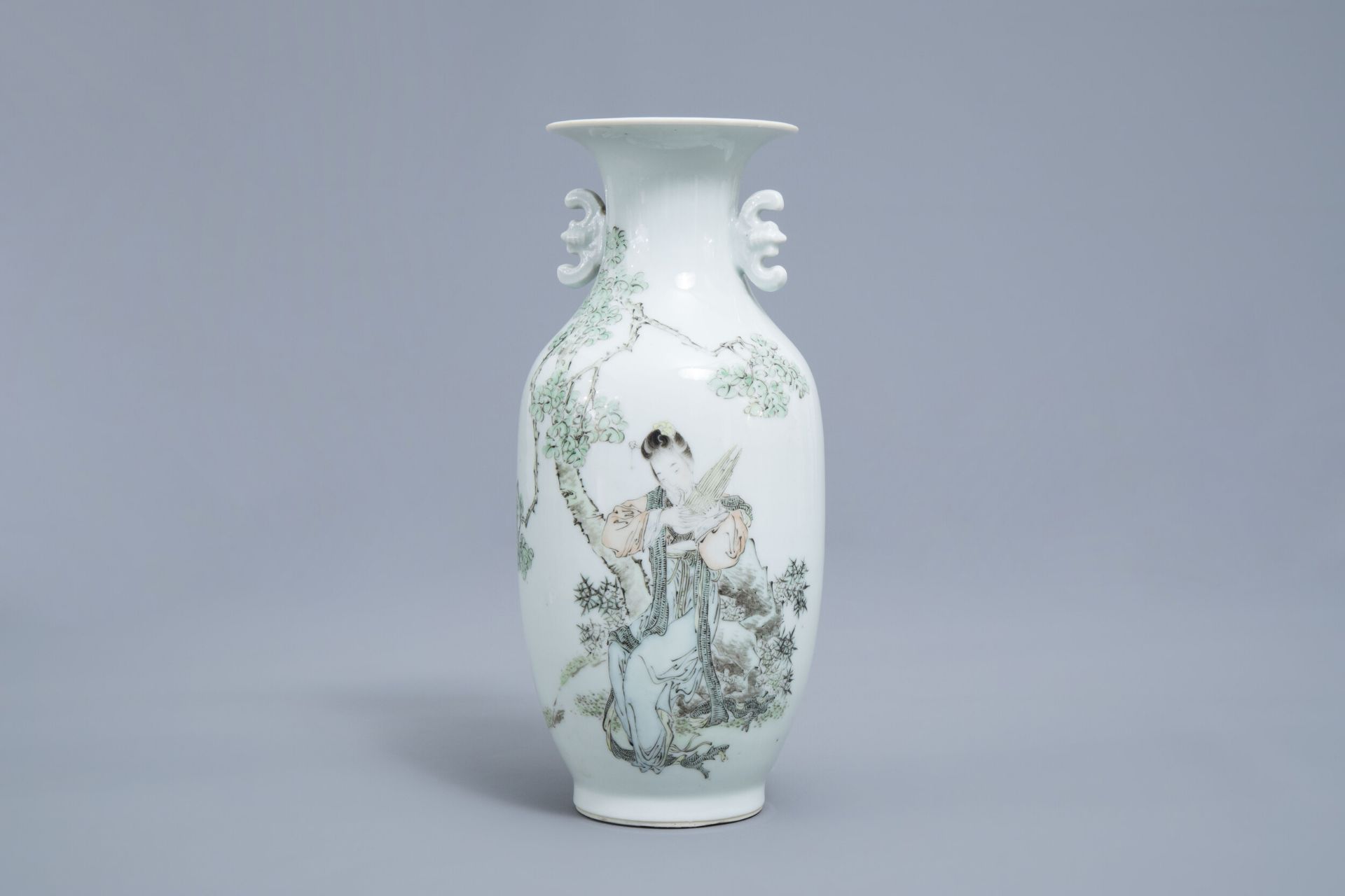 A fine Chinese qianjiang cai vase with a lady in a garden, 19th/20th C.