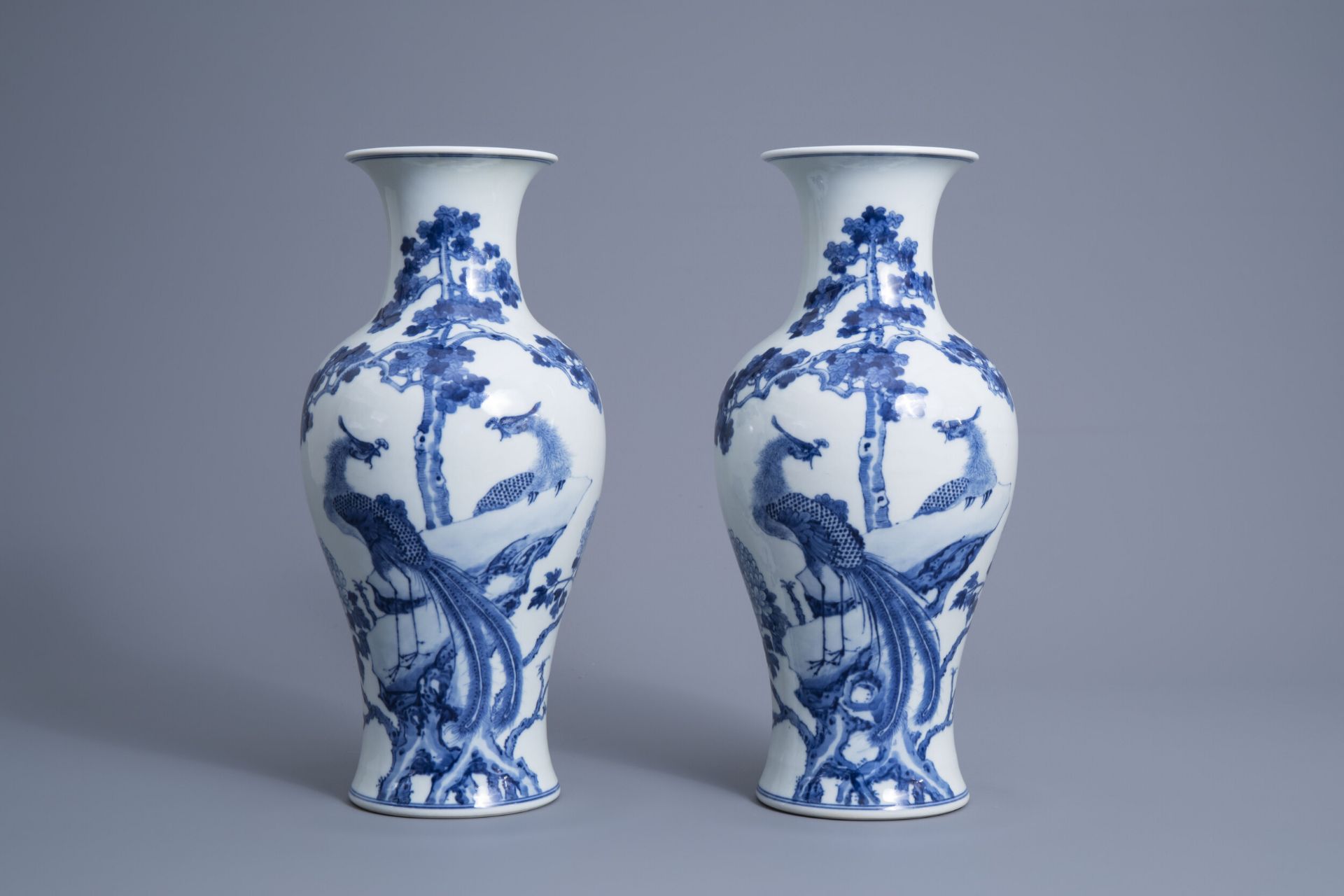 A pair of Chinese blue and white 'phoenix' vases, Republic, 20th C.