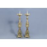 A pair of imposing French Gothic revival gilt brass candlesticks of architectural form, 19th C.