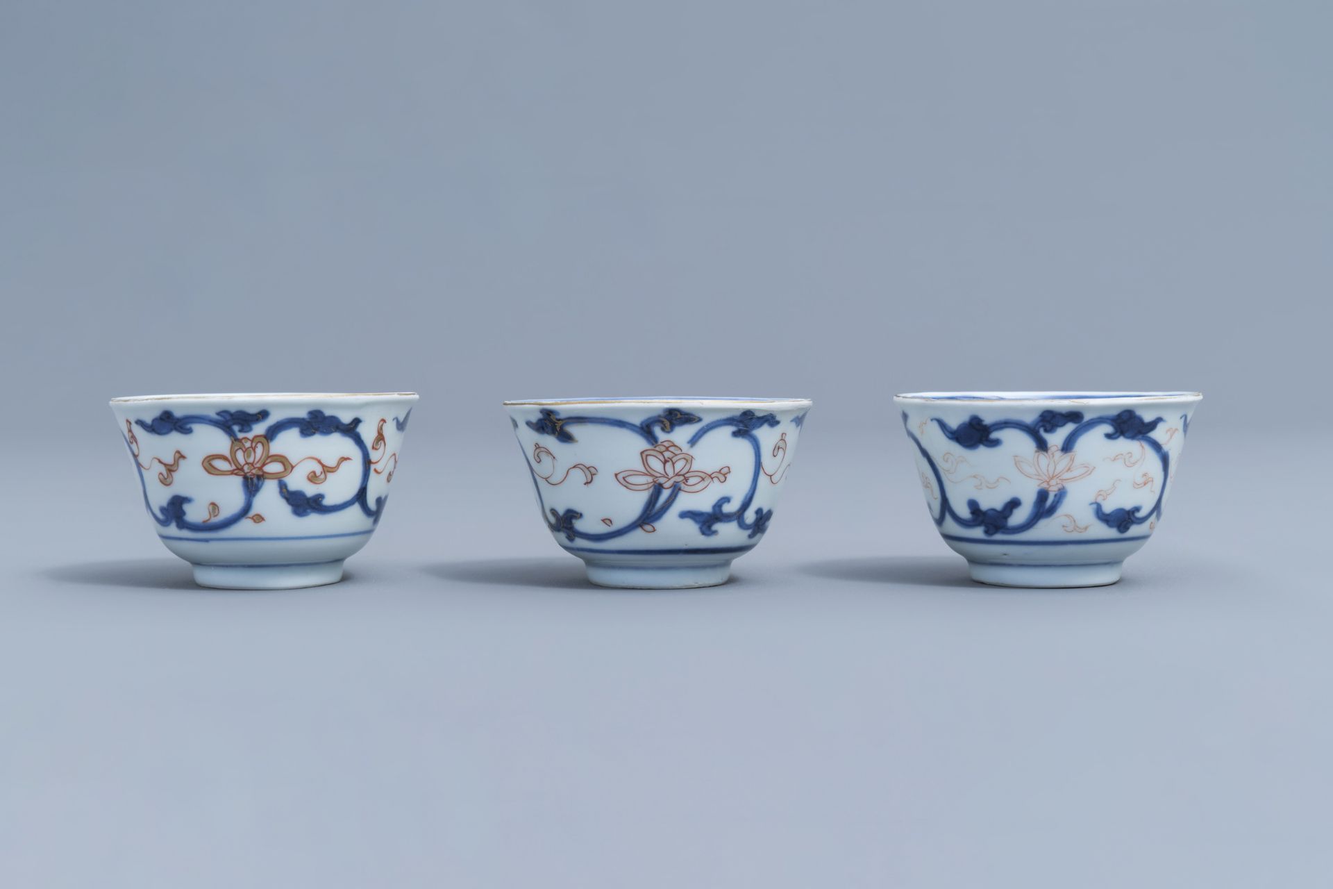 Six Chinese blue, white, iron red and gilt cups and saucers with floral design, Kangxi - Image 23 of 34