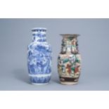 A Chinese blue and white rouleau vase and a famille rose Nanking vase, 19th C.